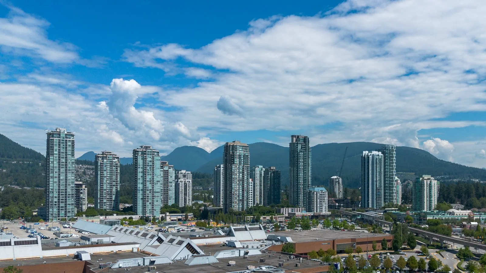 Coquitlam Town Centre towers below the North Shore mountains