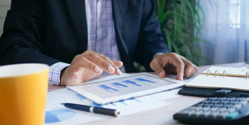 Monthly bookkeeping for a Port Coquitlam business, financial records updated on a tablet